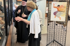 Georgia and Joan lead a tour of the exhibits for His Eminence Archbishop Elpidophoros